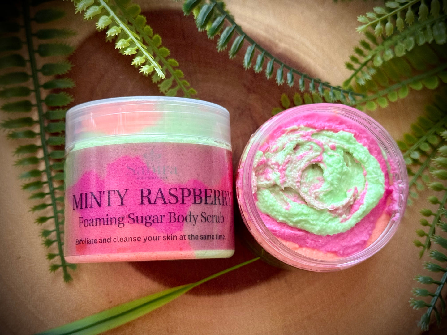 Minty Raspberry Sugar body scrub with vitamin e, shea butter and sweet almond oil to exfoliate and cleanse skin at the same time.