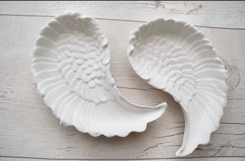 Angel wing trinket trays made with eco resin.