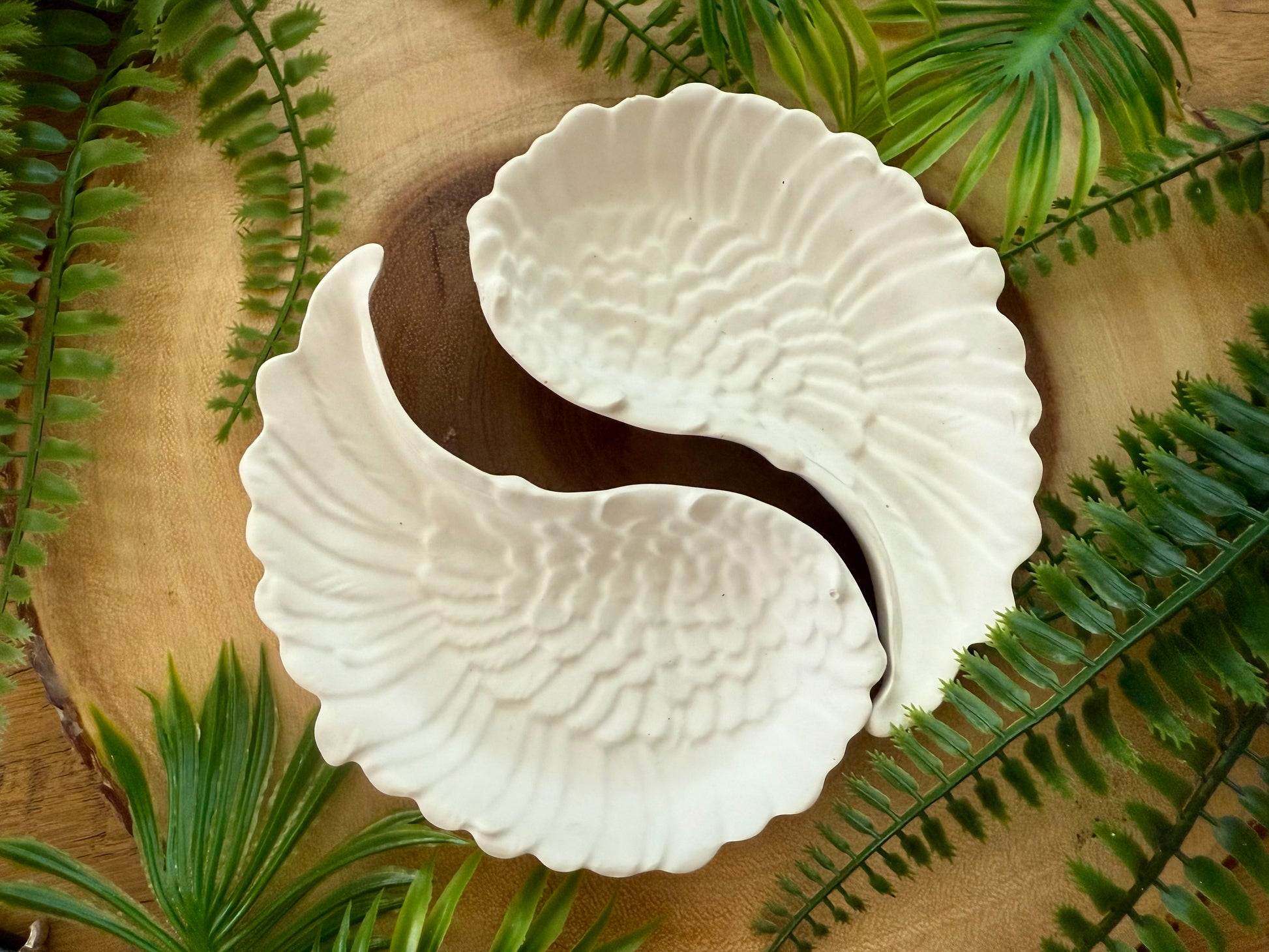 Angel wing trinket tray set to use as a tray for small items.