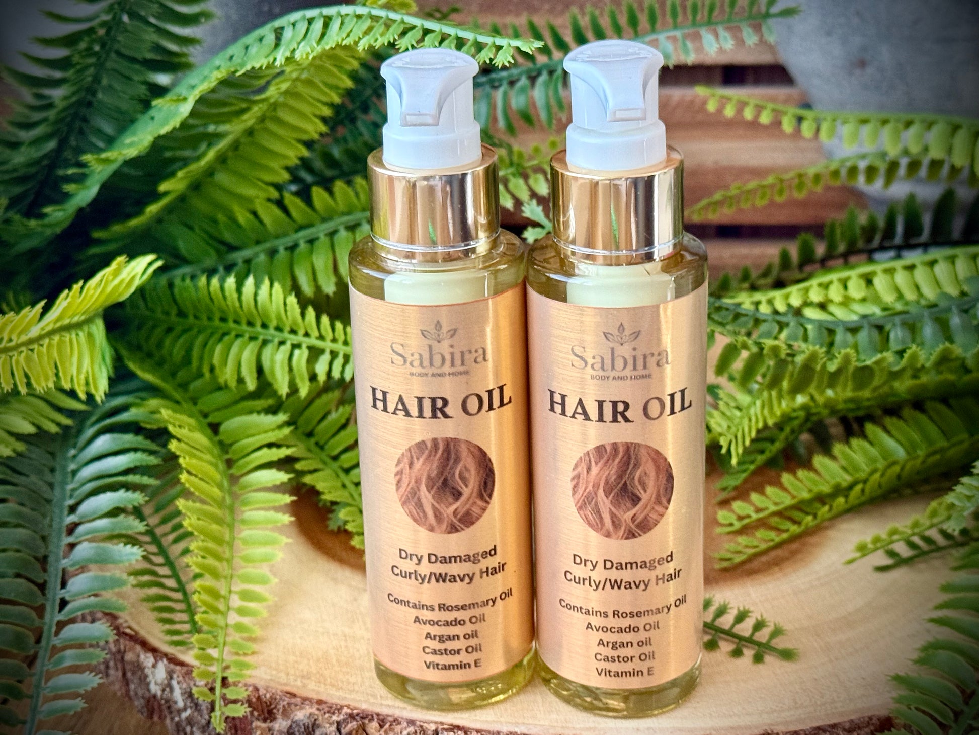 Hair oil for dry damaged and curly hair with natural oils including jojoba oil, Argan oil, Vitamin E and Rosemary essential oil. 