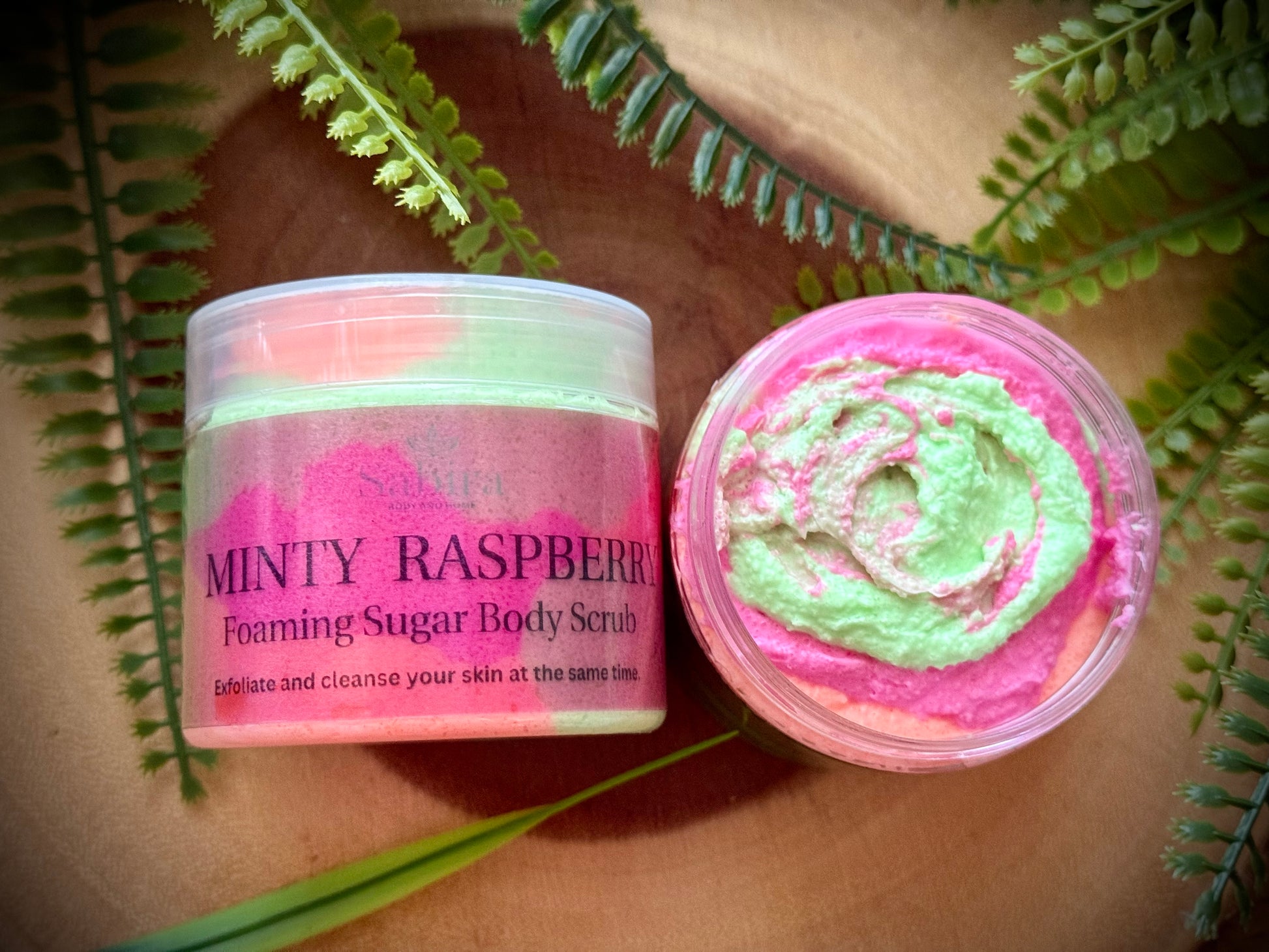 Minty Raspberry Sugar body scrub with vitamin e, shea butter and sweet almond oil to exfoliate and cleanse skin at the same time.