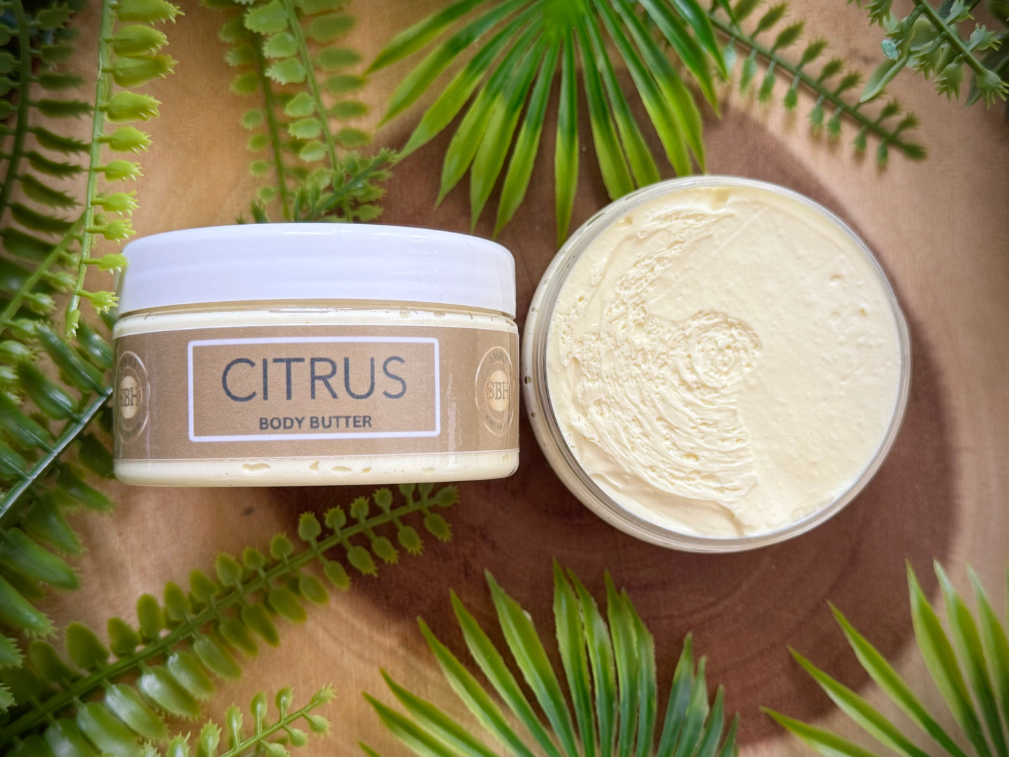 Body butter with natural oils and butters including shea butter and cocoa butter. Citrus scented body butter.