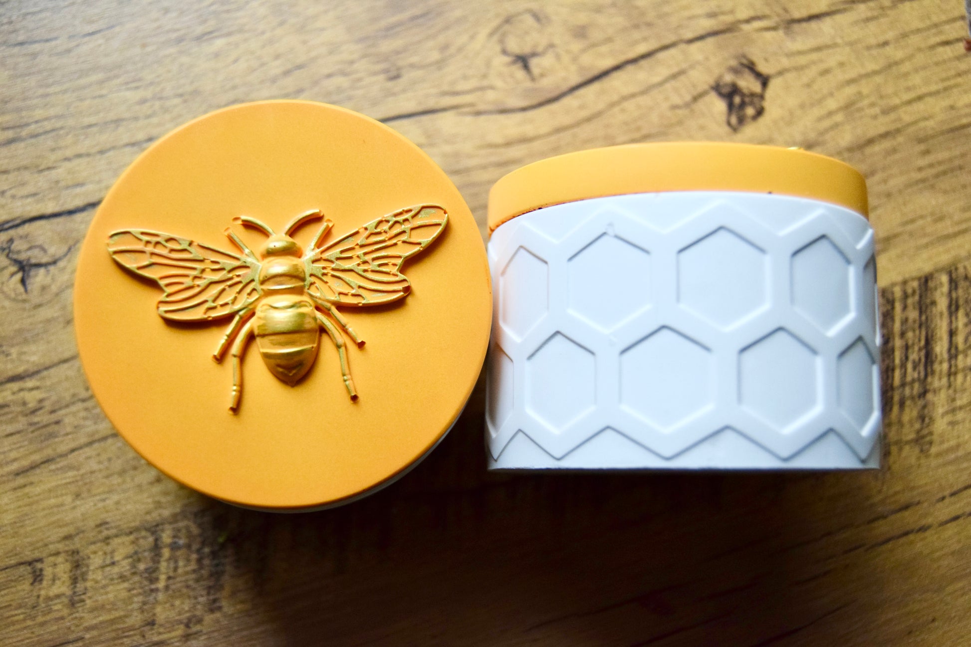 Yellow and white container with bee design and honeycomb pattern. Handmade from eco resin.